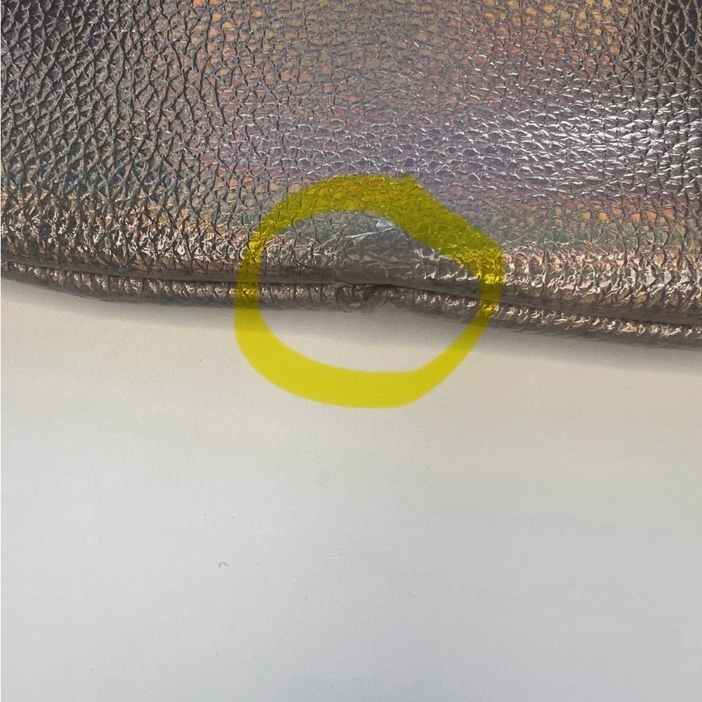 Juicy Couture Bronze iridescent Wristlet Clutch
Some wear - look closely - Picture 7 of 7